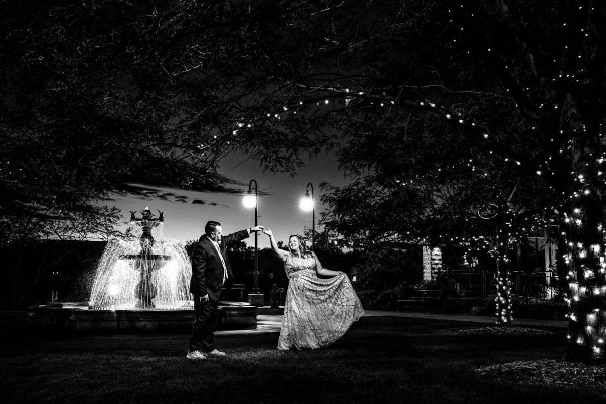 Couple dancing near the fountain at the Waterfront Restaurant in La Crosse, WI by La Crosse Photographer Jeff Wiswell of J.L. Wiswell Photography