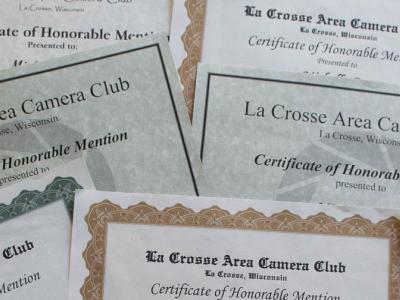 Pile of honorable mention certificates.
