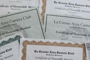 Pile of honorable mention certificates.